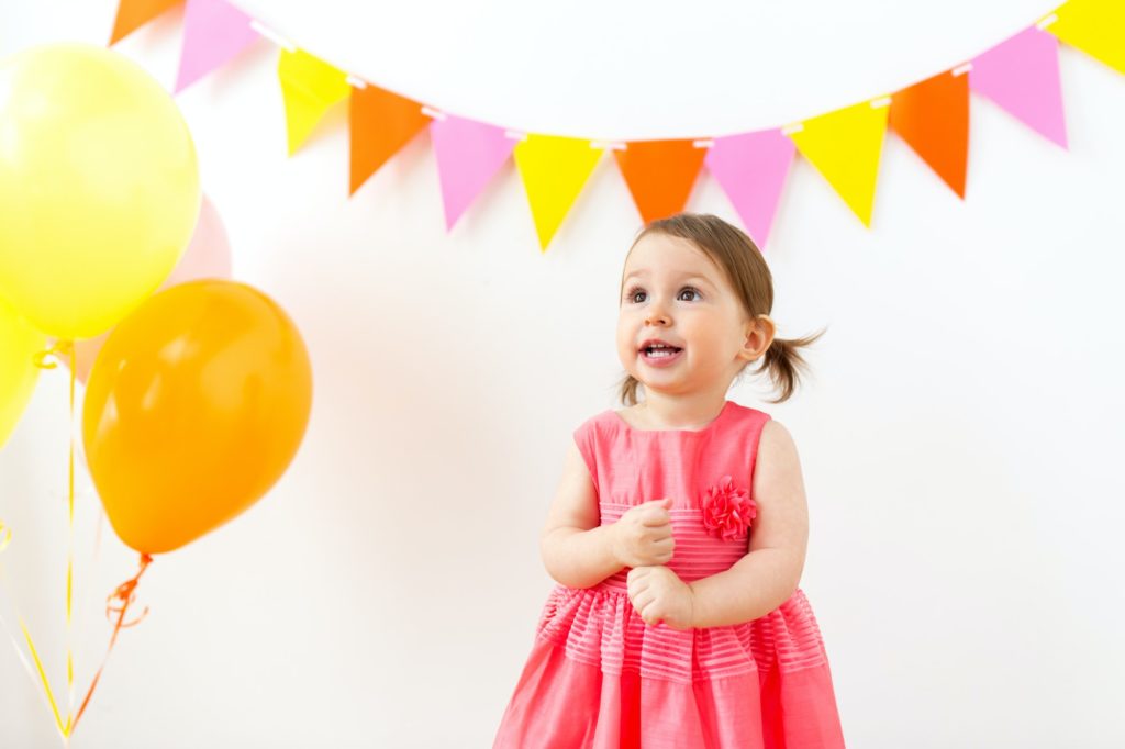 happy baby girl on birthday party